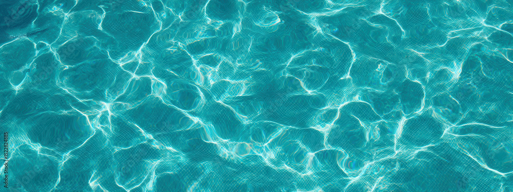 Obraz premium Rippling turquoise water creates a serene backdrop for summer relaxation and spa experiences from an aerial view during sunny days