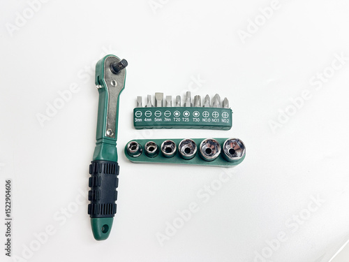 Set of stainless steel hex sockets and screwdriver bit isolated white background