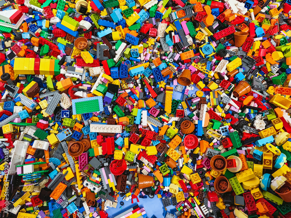 Obraz premium NAKHON PATHOM,THAILAND - JANUARY 17 ,2025 : Top view A pile of multicolor of many Lego toy blocks in various shapes and different sizes at Central salaya. Toys and games. Leisure and recreation.