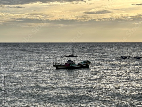fishing boat at sunset,Bang Saen, Chonburi, Thailand