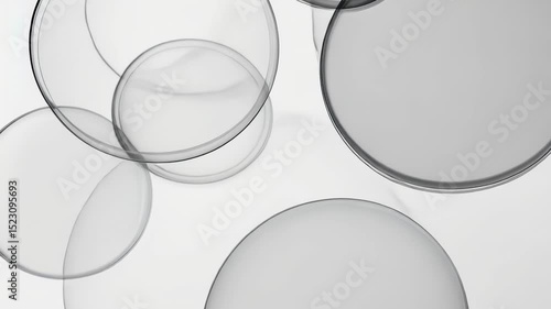 Clear Glass Bowl with White Liquid Isolated on Blue Background