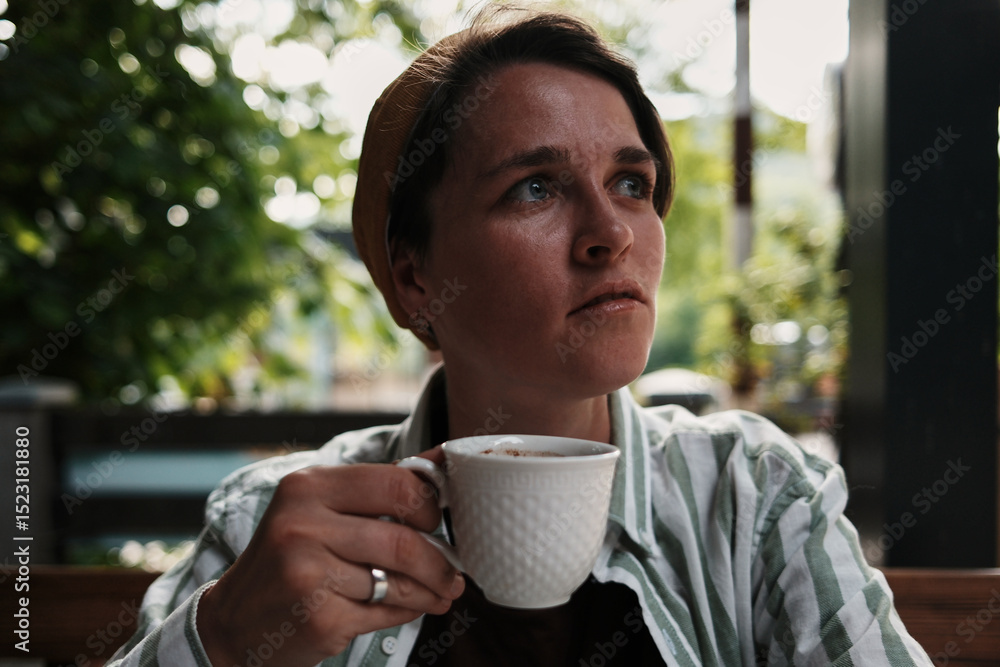 Woman enjoying a cup of strong Serbian coffee at an outdoor cafe in Tara National Park. Woman enjoying a cup of strong Serbian coffee at an outdoor cafe in Tara National Park.