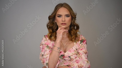 Beautiful young fashion model posing in studio  for hair and make up shoot