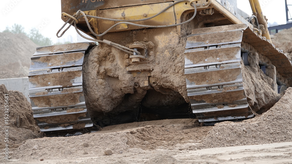 Fototapeta premium A bulldozer digging an excavation at a construction site.