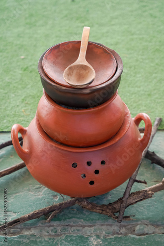 The beauty of culinary craftsmanship in a collection of earthenware pots, perfect to highlight the charm of ancestral cooking