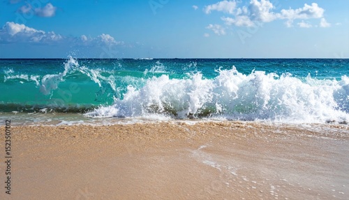 Splashing turquoise wave meets golden sand on a sunny shoreline vista