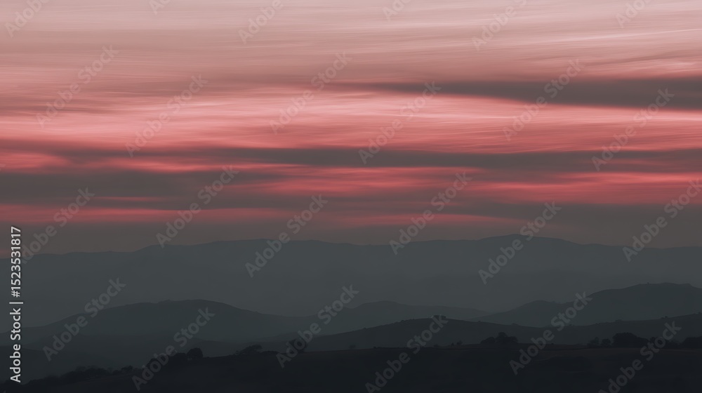 Fototapeta premium Pink sky over mountain range
