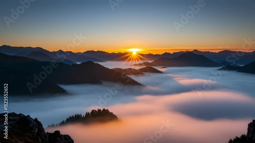 Scenic Mountain Peaks Surrounded By Fog Illuminated By Orange Sunset Sky