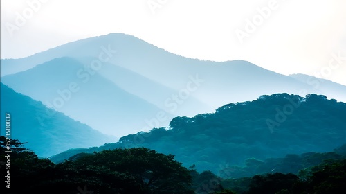 Blue hazy mountains with forested foothills