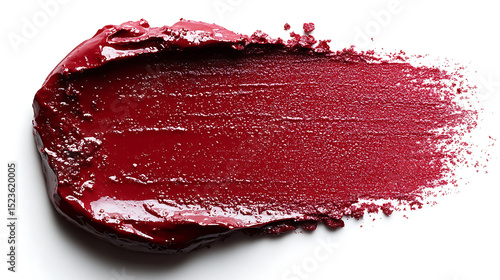 Deep red lipstick smear texture on white background displaying vibrant color and richness of formula