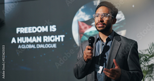 фотографія Man, speech and mic at conference event of conflict, freedom and human rights crisis