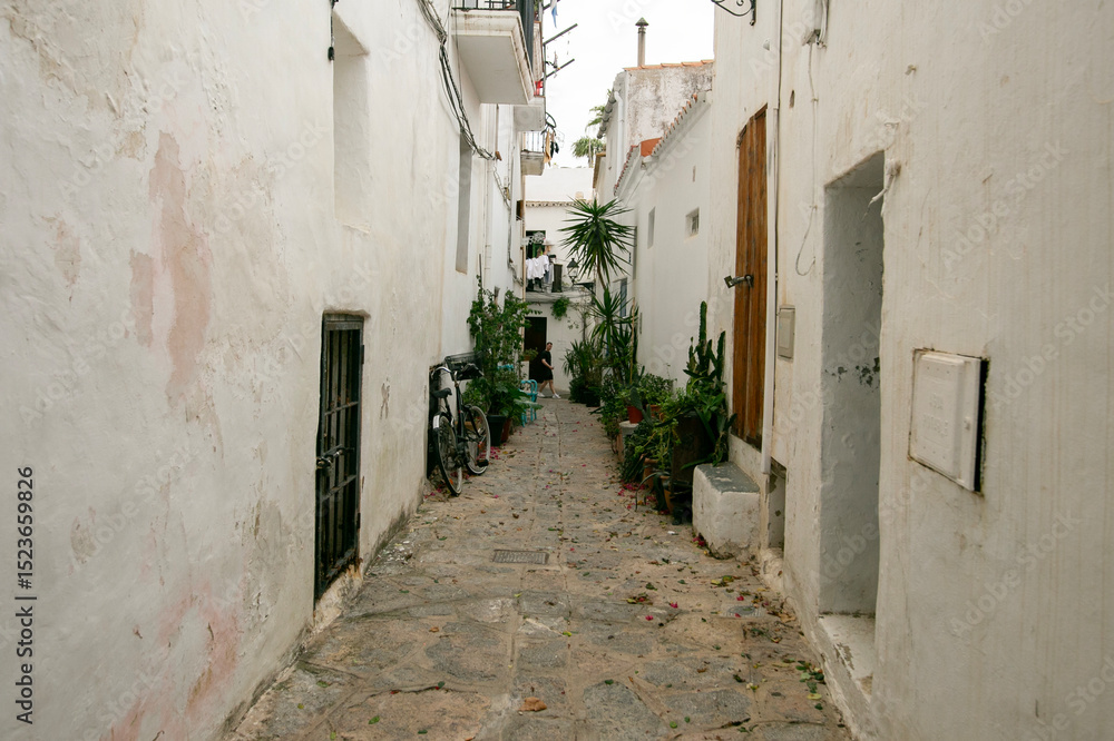 Obraz premium Streets and views of the ancient walled citadel of Dalt Vila, a UNESCO World Heritage Site, on the island of Ibiza in Spain.