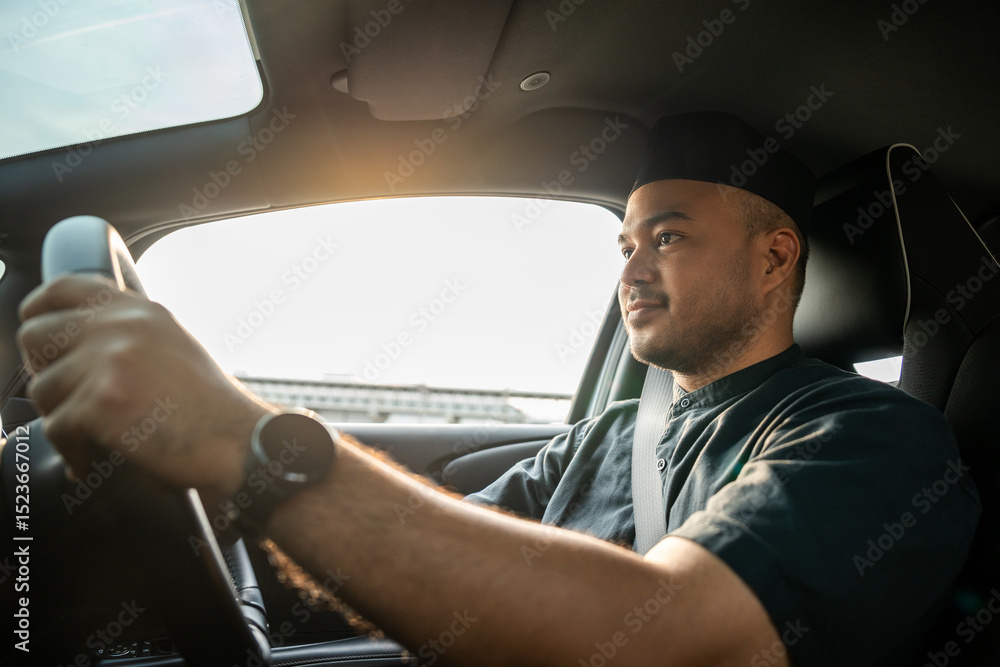 Obraz premium Asian muslim business man getting new car. Happy and excited. Smiling man islamic driving vehicle on the road wearing songkok cap. Businessman buying driving new car