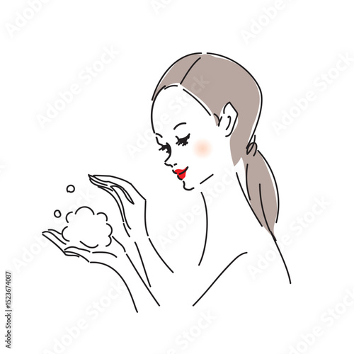 丁寧にスキンケアをする美しい女性