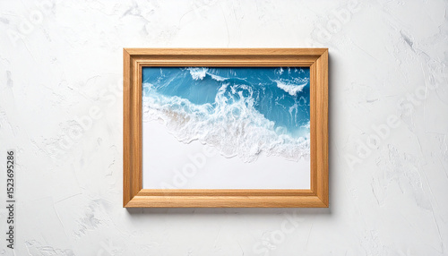 Fototapeta Naklejka Na Ścianę i Meble -  The sea and waves are in the frame hung on the rough white wall.