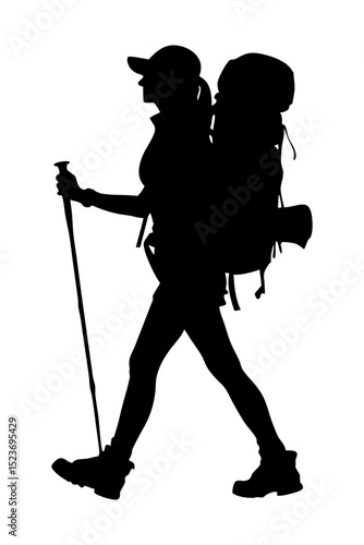 Silhouette of a female hiker with a backpack and poles