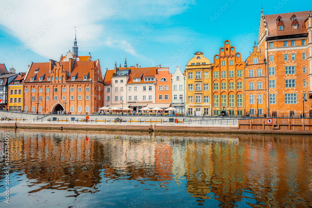 Fototapeta premium Gdansk with Motlawa river in Poland. Old town colourful house with Holy Spirit Gate