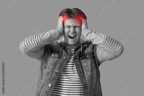 Young man with severe heada...