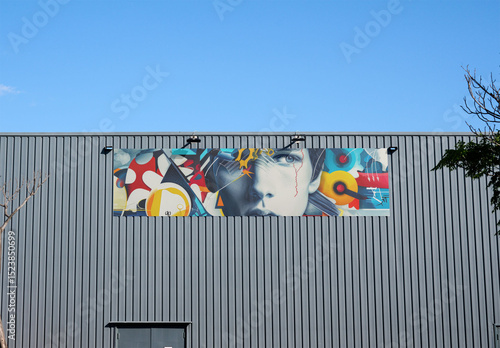 Horizontal Billboard retail business Mockup Displayed on wharehouse Facade