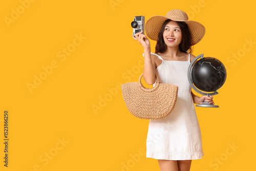 Young Asian woman with glob...