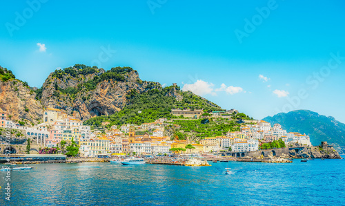 Amalfi  coastline in southern Italy, vertiginous cliffs adorned with colorful villages, turquoise waters. Town Amalfi on Amalfi Coast in province of Salerno, Campania region, Italy