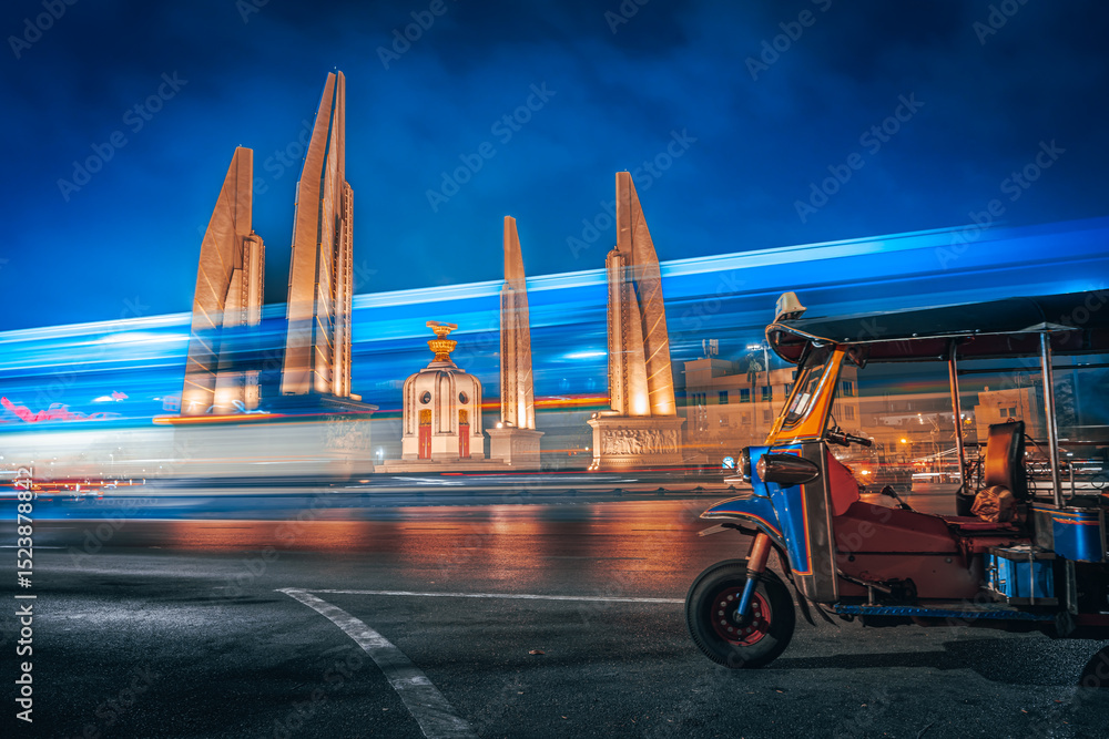 Naklejka premium Thailand famous attraction Democracy Monument Bangkok and iconic landmark Tuk Tuk near tourist street Khaosan Road Bangkok, Thailand