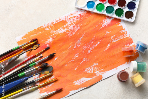Artist brushes, paints and ...