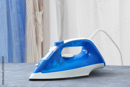 Electric iron on board near...