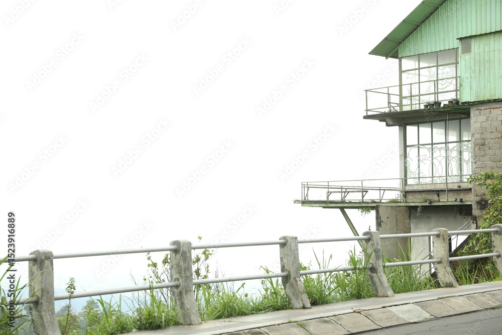 Fototapeta premium Safety railing along road and old building. Space for text
