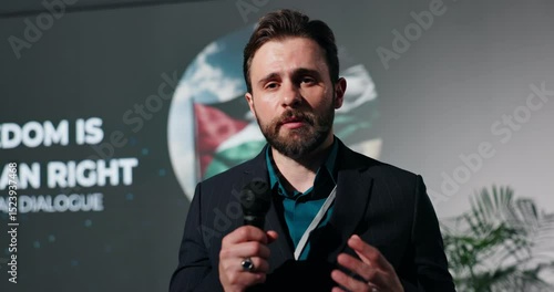 Businessman, presentation or seminar with mic for freedom speech, human rights or peace. Man, speaker or spokesperson talking for free palestine, cease fire or fight for global equality or humanity
