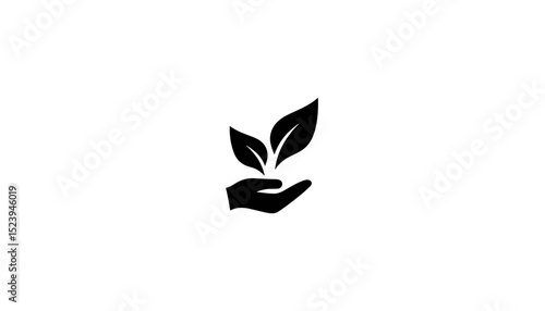 Hand holding two green leaves