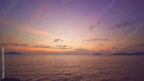 Colorful sunset or sunrise above the sea surface,Aerial view drone fly over open sea,Reflected sun beautiful light of nature on water surface,Sunset over ocean,Sea summer and travel vacation concept