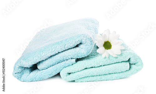 Soft towels and chrysanthemum flower isolated on white