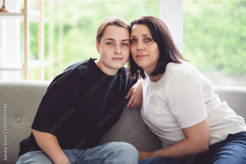Fototapeta premium mother with teen girl, having great time on sofa