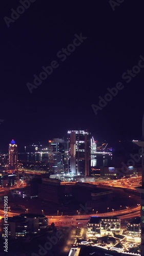 Wallpaper Mural Night view of iconic skyscrapers and busy traffic on a major interchange in Downtown Dubai, UAE. Stunning skyline of a modern city, symbolizing business, finance, and urban development Torontodigital.ca
