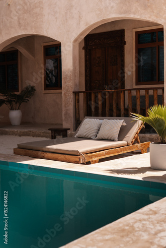 Boutique hotel swimming pool and sun lounger, Zanzibar