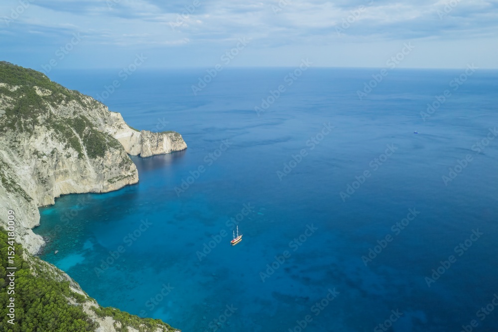 A barefoot traveler strolls along a sun-heated stone path surrounded by olive trees in Zakynthos. The vintage postcard of Navagio ghost ship evokes a nostalgic Mediterranean summer A barefoot traveler strolls along a sun-heated stone path surrounded by olive trees in Zakynthos. The vintage postcard of Navagio ghost ship evokes a nostalgic Mediterranean summer