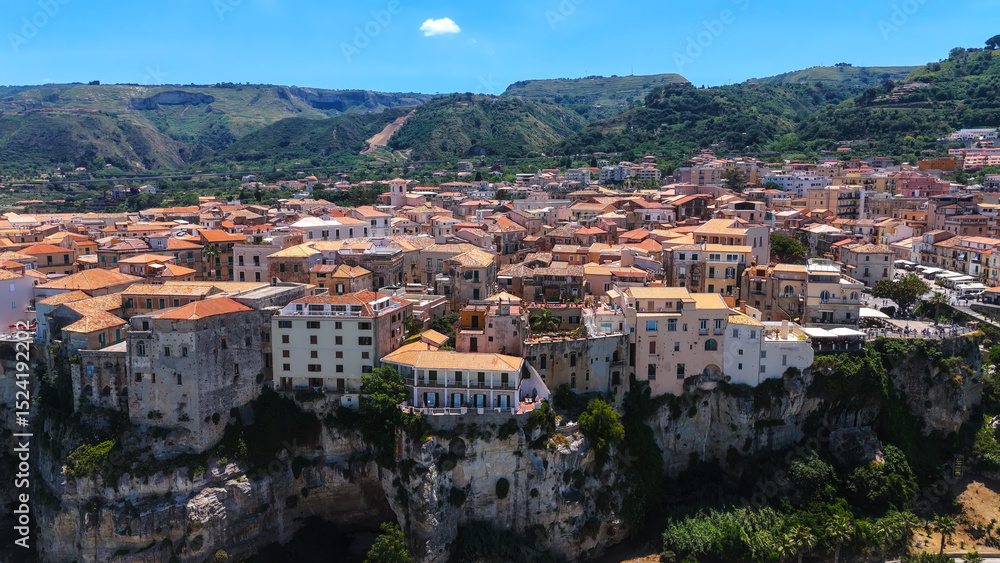Fototapeta premium Aerial view of Tropea, a charming town in Calabria, Italy, with colorful buildings on a cliff overlooking the Tyrrhenian Sea