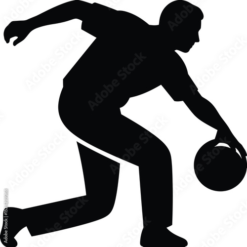 A silhouette of a bowler in action preparing to release the bowling ball in a bowling alley game