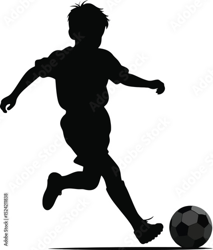 A silhouette of a young boy kicking a soccer ball with his right foot against a white background