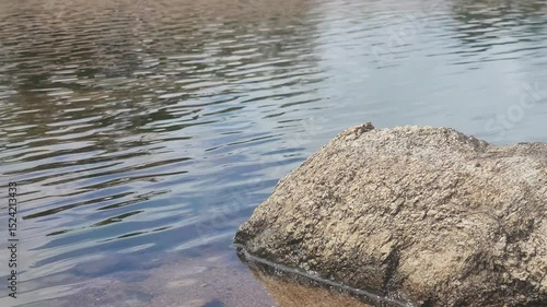 water flowing into the river and rock