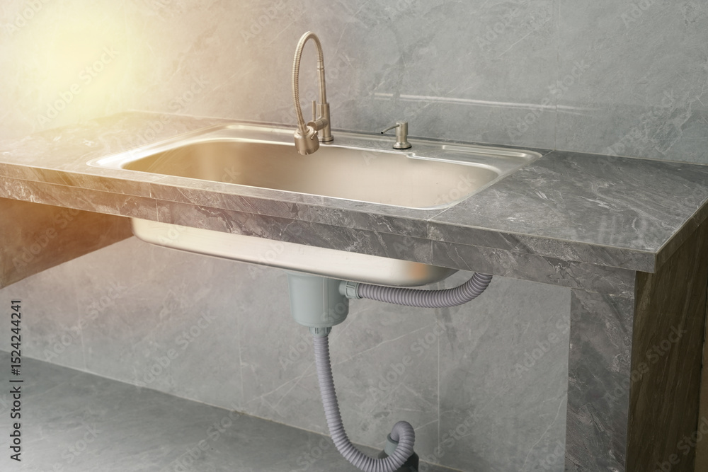Fotografie modern kitchen sink installed on grey marble concept