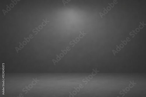 Dimly lit, empty gray room with smooth floor and spotlight effect on wall creates moody atmosphere. minimalist space is ideal for creative projects or presentations