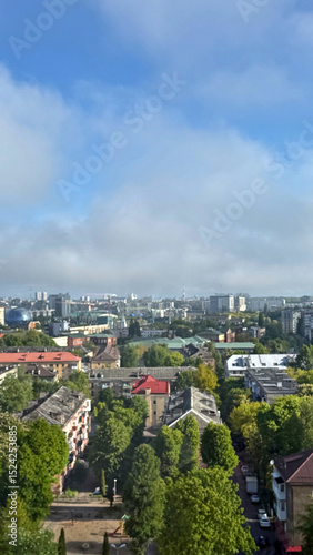 Wallpaper Mural A wide-angle view from a high window overlooking the rooftops of Kaliningrad. The scene captures the mix of modern and historic architecture under a clear or cloudy sky Torontodigital.ca
