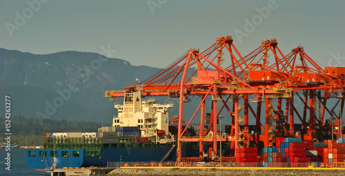 Large Gantry Crane Loading a Container Ship at Coal Harbor, Vancouver British Columbia.,CAN