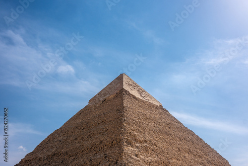 Top of pyramid of Khufu against a clear blue sky