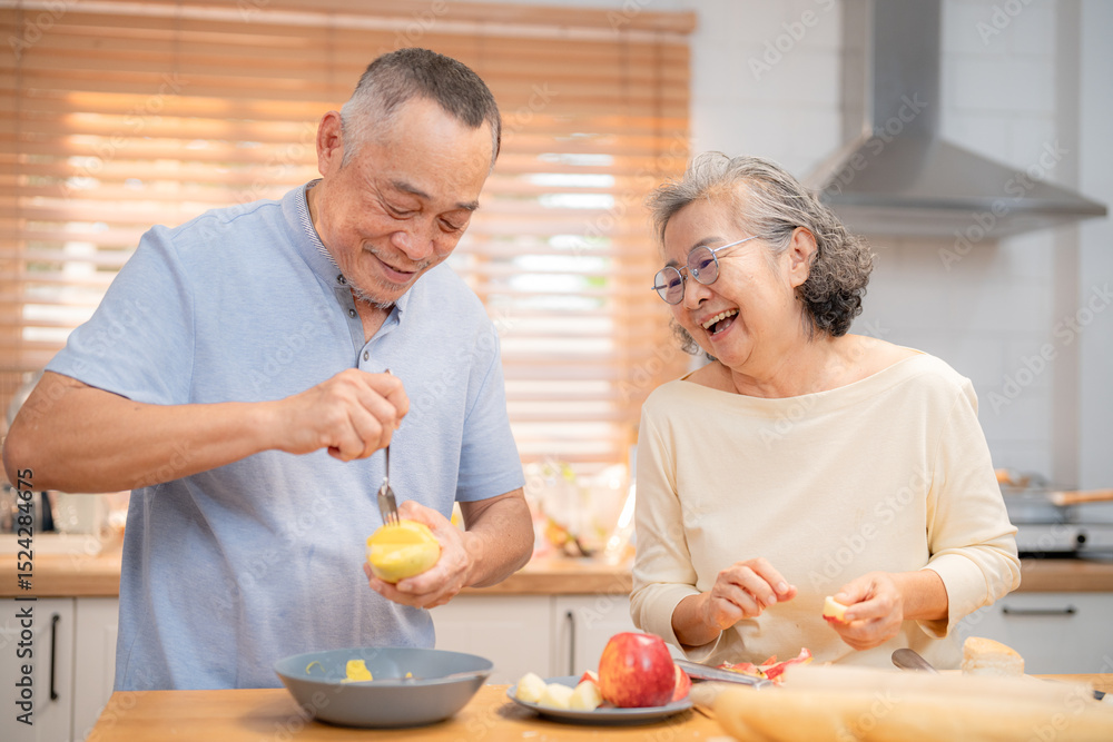 Joyful couple enjoys cooking together in a bright kitchen during a sunny afternoon Joyful couple enjoys cooking together in a bright kitchen during a sunny afternoon