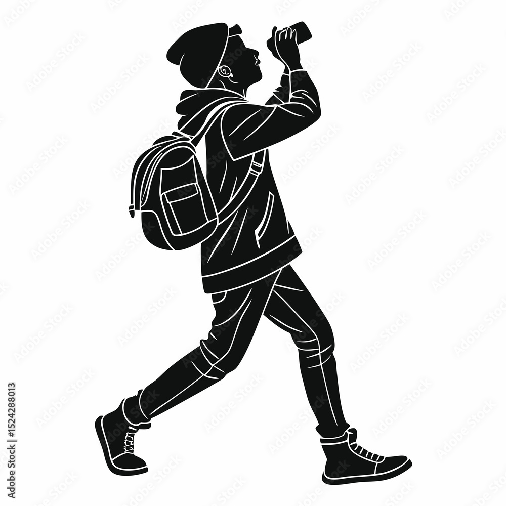 Fototapeta premium Young person with backpack taking photo silhouette