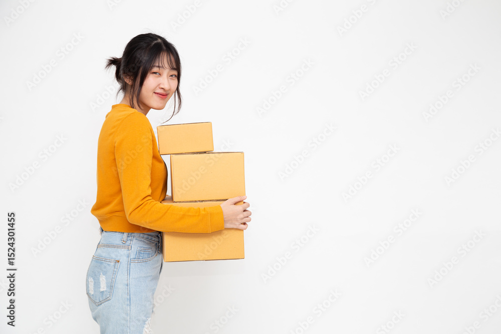 Happy Asian woman smiling and holding package parcel box isolated on white background, Delivery courier and shipping service concept Happy Asian woman smiling and holding package parcel box isolated on white background, Delivery courier and shipping service concept