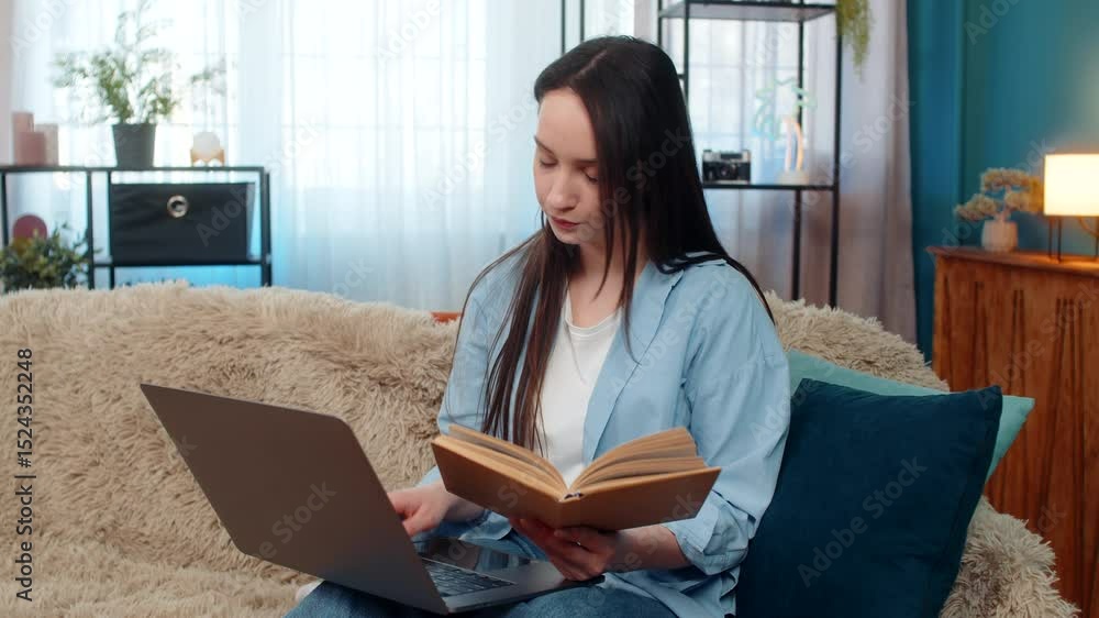 Young woman at home studying online seriously and focused with laptop and book, carefully making notes. Caucasian student girl on sofa involved in remote learning, education activity, academic work Young woman at home studying online seriously and focused with laptop and book, carefully making notes. Caucasian student girl on sofa involved in remote learning, education activity, academic work